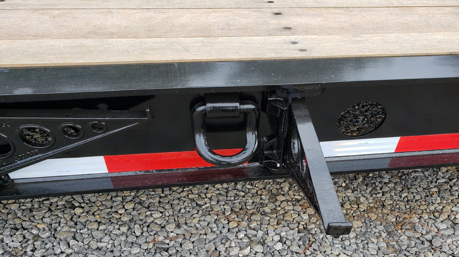 Swing-out brackets to handle wider equipment or cargo